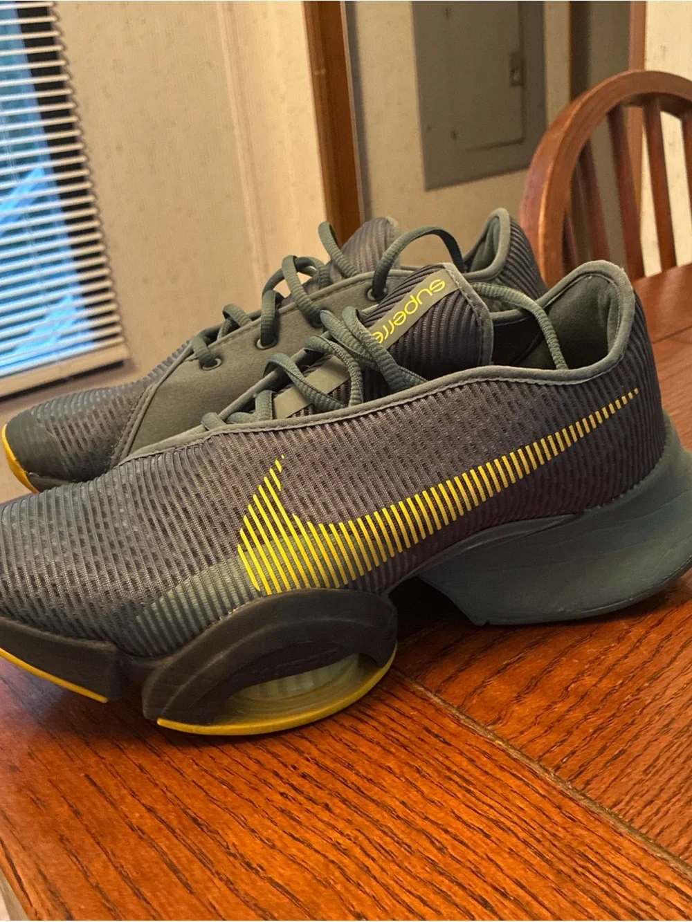 Nike Men’s Gray Athletic Shoes with Yellow Swoosh